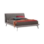 The Diva bed by Gienne Group is an upholstered double bed model characterized by a contemporary and evocative design, renowned for the unique craftsmanship of its headboard.