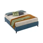 The Mia bed by Gienne is a padded, fabric-upholstered bed designed for those seeking modern furniture that combines aesthetics and practicality, especially in compact living spaces.