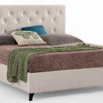 The Asmara bed by Gienne is an upholstered double bed that stands out for its elegant aesthetics and classic-inspired design, updated for contemporary settings.