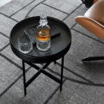 The Arena coffee table by Calligaris pairs minimalism with fashion-inspired artisanal details.